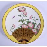 AN AESTHETIC MOVEMENT PORCELAIN PLATE painted with fans. 20.5 cm diameter.