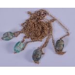 AN UNUSUAL FOUR EGYPTIAN SCARAB BEETLE AMULET NECKLACE one referring to King Amenhotep III, mounted