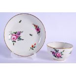 18th c. Chelsea Derby teabowl and saucer painted with a large rose bouquet and other scattered flowe