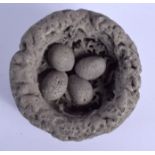 A FOSSILISED FOUR EGG BIRDS NEST. 8.5 cm wide.