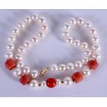 A 14CT PEARL AND CORAL NECKLACE. 40 cm long.