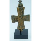 A Byzantine bronze cross on a stand 11cm.