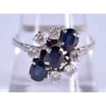 AN ART DECO WHITE GOLD DIAMOND AND SAPPHIRE RING. Q. 5 grams.