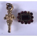 AN ANTIQUE PIN and a fob. 9 grams. (2)