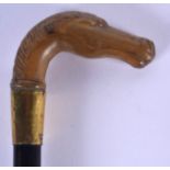 A VERY RARE 19TH CENTURY CONTINENTAL CARVED RHINOCEROS HORN HORSE HEAD WALKING CANE. 68 cm long.