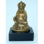 A small Chinese Tibetan gilt bronze Buddha mounted on a base. 6cm.