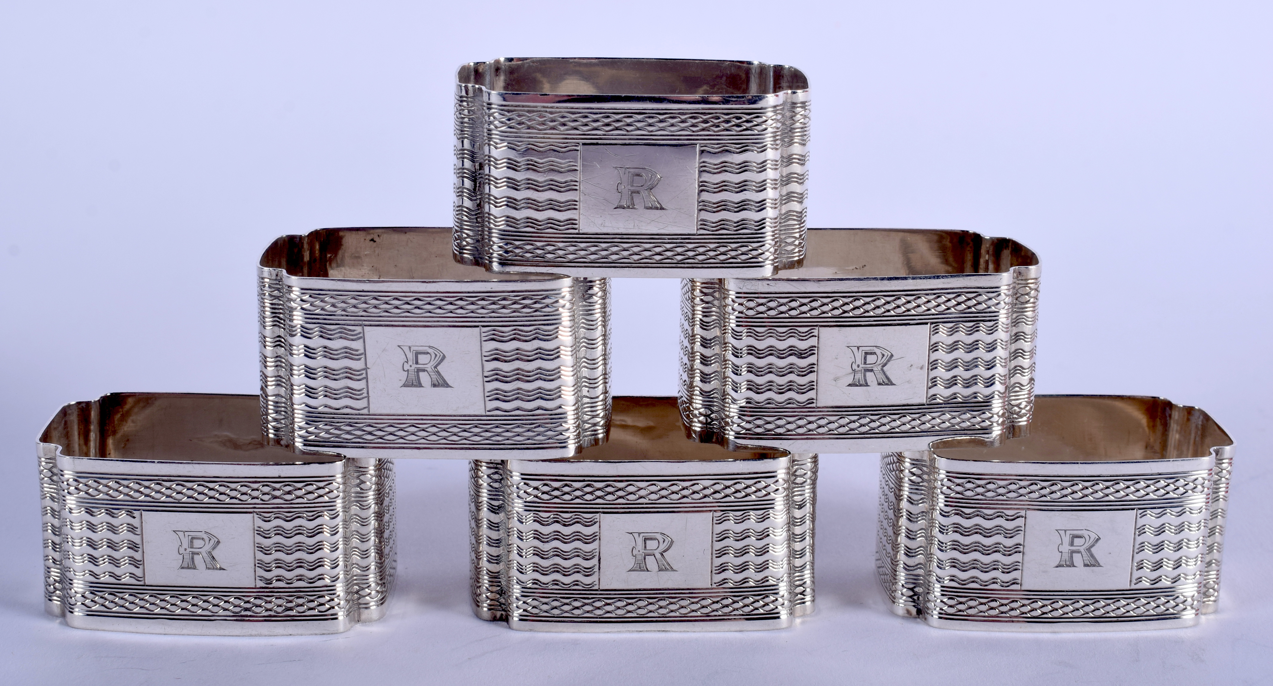 SIX 1930S ART DECO NAPKIN RINGS. (6)