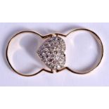 A 14CT GOLD AND DIAMOND SWIVEL HEART RING. 8 grams. S.