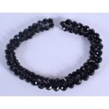 A VINTAGE WHITBY JET NECKLACE. 86 cm long.