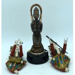 A vintage lighter and two wooden Thai figures (29cm)