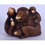 A 19TH CENTURY JAPANESE MEIJI PERIOD CARVED IVORY OKIMONO modelled as a monkey with is young. 4 cm x