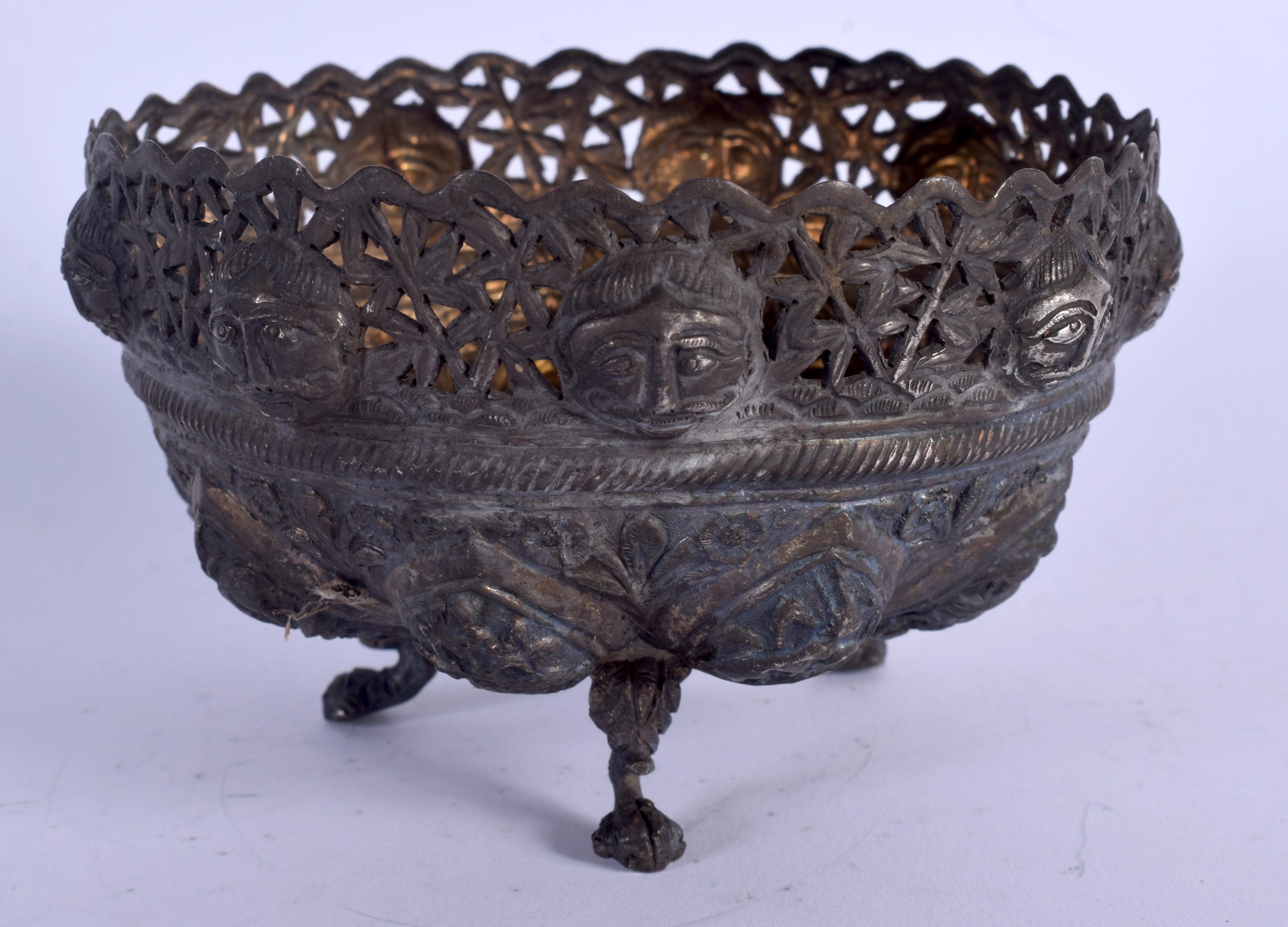 AN ANTIQUE INDO TIBETAN SILVER PIERCED BOWL decorated with buddhistic figures. 149 grams. 7.5 cm x 1