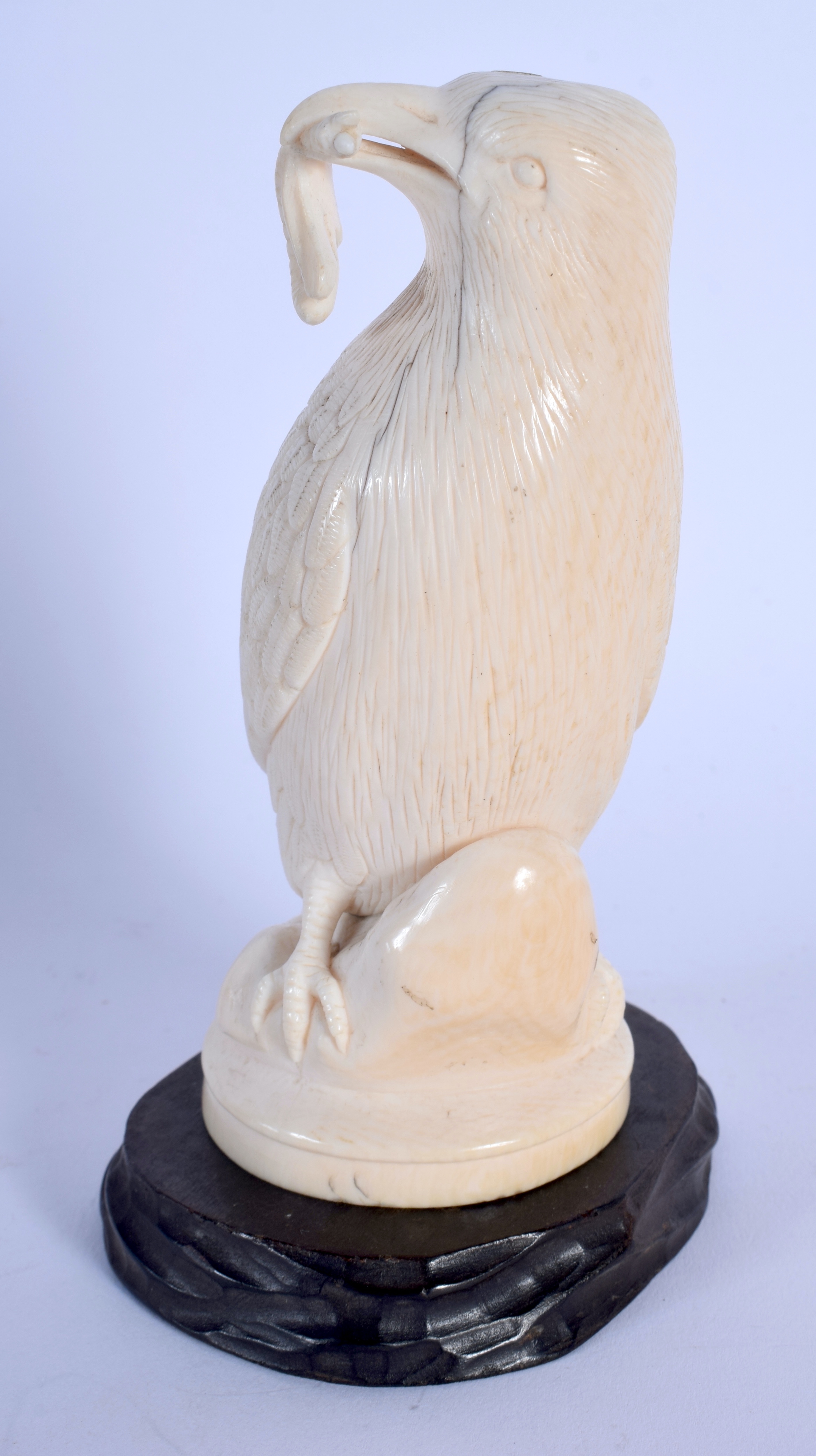 A 19TH CENTURY EUROPEAN CARVED IVORY FIGURE OF A BIRD modelled holding an insect within its mouth. 1 - Image 2 of 4