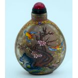 A Chinese glass snuff bottle decorated with birds and foliage . 8cm.