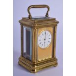 A LATE 19TH CENTURY MINIATURE FRENCH CARRIAGE CLOCK with engine turned body. 9 cm high inc handle.
