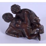 A JAPANESE CARVED BOXWOOD EROTIC NETSUKE. 6 cm x 4 cm.