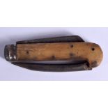 A 19TH CENTURY CONTINENTAL CARVED RHINOCEROS HORN COMBINATION KNIFE. 21 cm long extended.