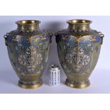 A LARGE PAIR OF 19TH CENTURY CHINESE BRONZE AND CHAMPLEVE ENAMEL BRONZE VASES decorated with motifs