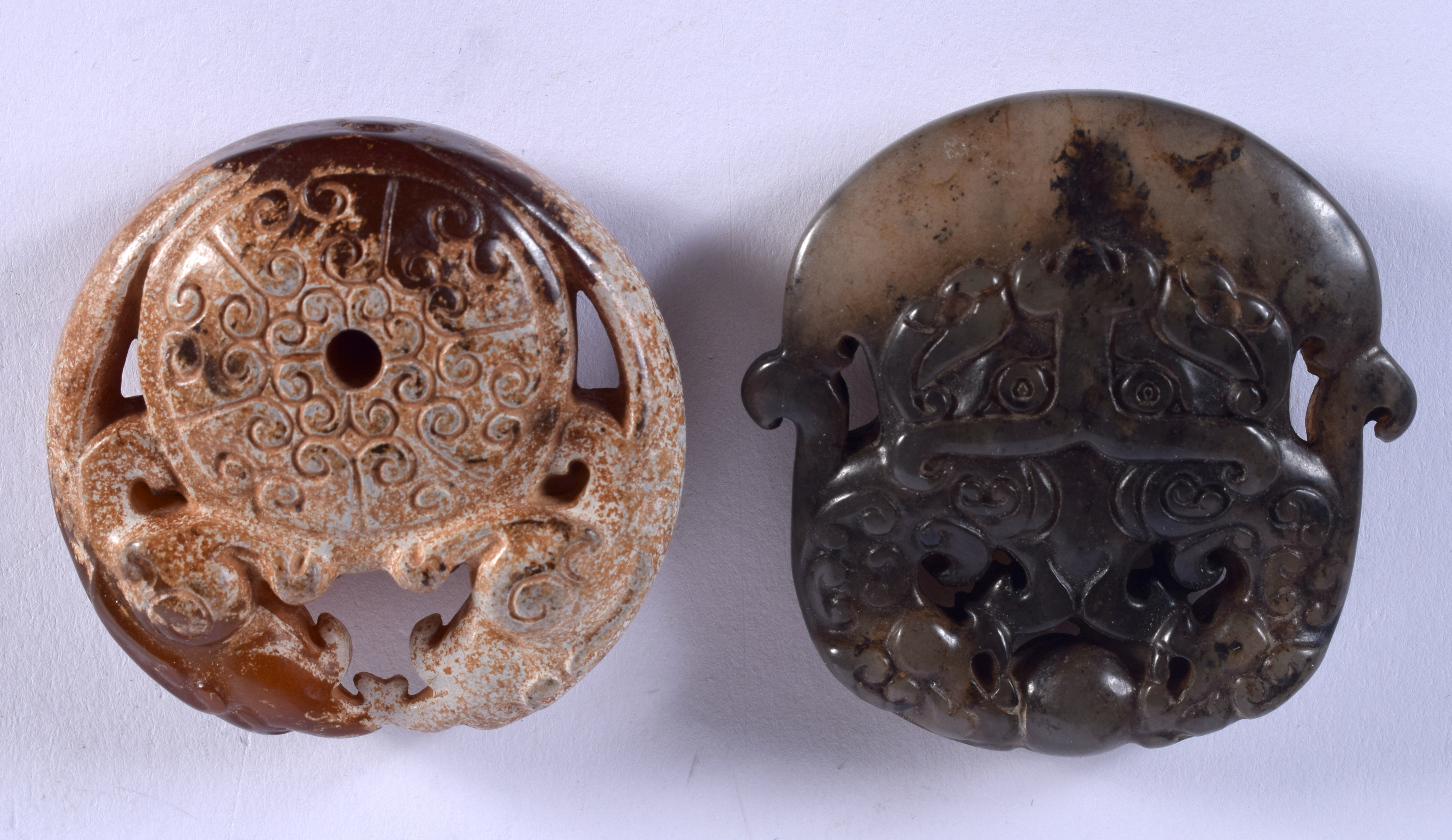 TWO CHINESE JADE ROUNDELS 20th Century. 4 cm x 5 cm. (2)