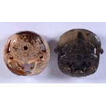 TWO CHINESE JADE ROUNDELS 20th Century. 4 cm x 5 cm. (2)