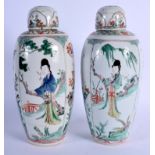 A LOVELY PAIR OF 17TH CENTURY CHINESE FAMILLE VERTE PORCELAIN VASES AND COVERS Kangxi, enamelled wit