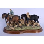 A BORDER FINE ARTS FIGURE OF A SHIRE HORSES modelled with an attendant. 34 cm x 20 cm.