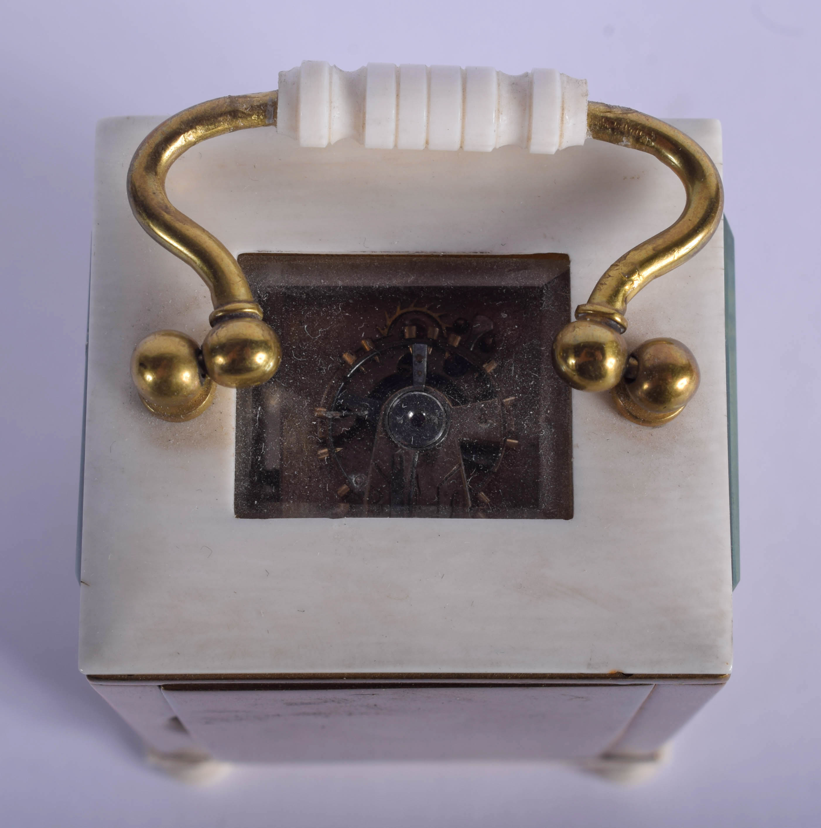 A 19TH CENTURY EUROPEAN MINIATURE CARVED IVORY CARRIAGE CLOCK of plain form. 9 cm high inc handle. - Image 4 of 4