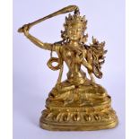 A CHINESE SINO TIBETAN GILT BRONZE FIGURE OF A BUDDHISTIC DEITY modelled upon a triangular base. 19