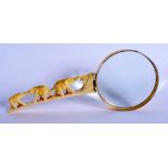 A 19TH CENTURY JAPANESE MEIJI PERIOD CARVED IVORY MAGNIFYING GLASS with elephant handle. 25 cm wide.