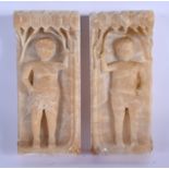 A RARE PAIR OF 18TH CENTURY ENGLISH ALABASTER CARVED PLAQUES depicting two figures holding trailing