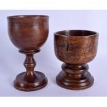 A TREEN CARVED WOOD GOBLET together with a similar mortar. Largest 17 cm x 7 cm. (2)