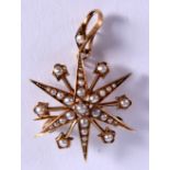 A VICTORIAN 15CT GOLD STAR BROOCH. 5 cm wide.