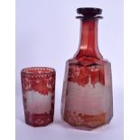 A 19TH CENTURY BOHEMIAN RUBY GLASS DECANTER AND STOPPER together with a similar beaker. 24 cm high.