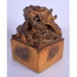 A LARGE CHINESE GILT BRONZE DRAGON SEAL 20th Century. 14 cm x 8 cm.