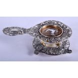 A 19TH CENTURY CONTINENTAL SILVER TEA STRAINER ON STAND. 87 grams. 12 cm x 7 cm. (2)