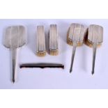 AN ART DECO SILVER DRESSING TABLE SET. Birmingham 1933. 705 grams overall. (6)