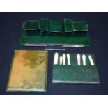 A vintage grooming set in green leather with folding mirror 37 x 18cm (3).