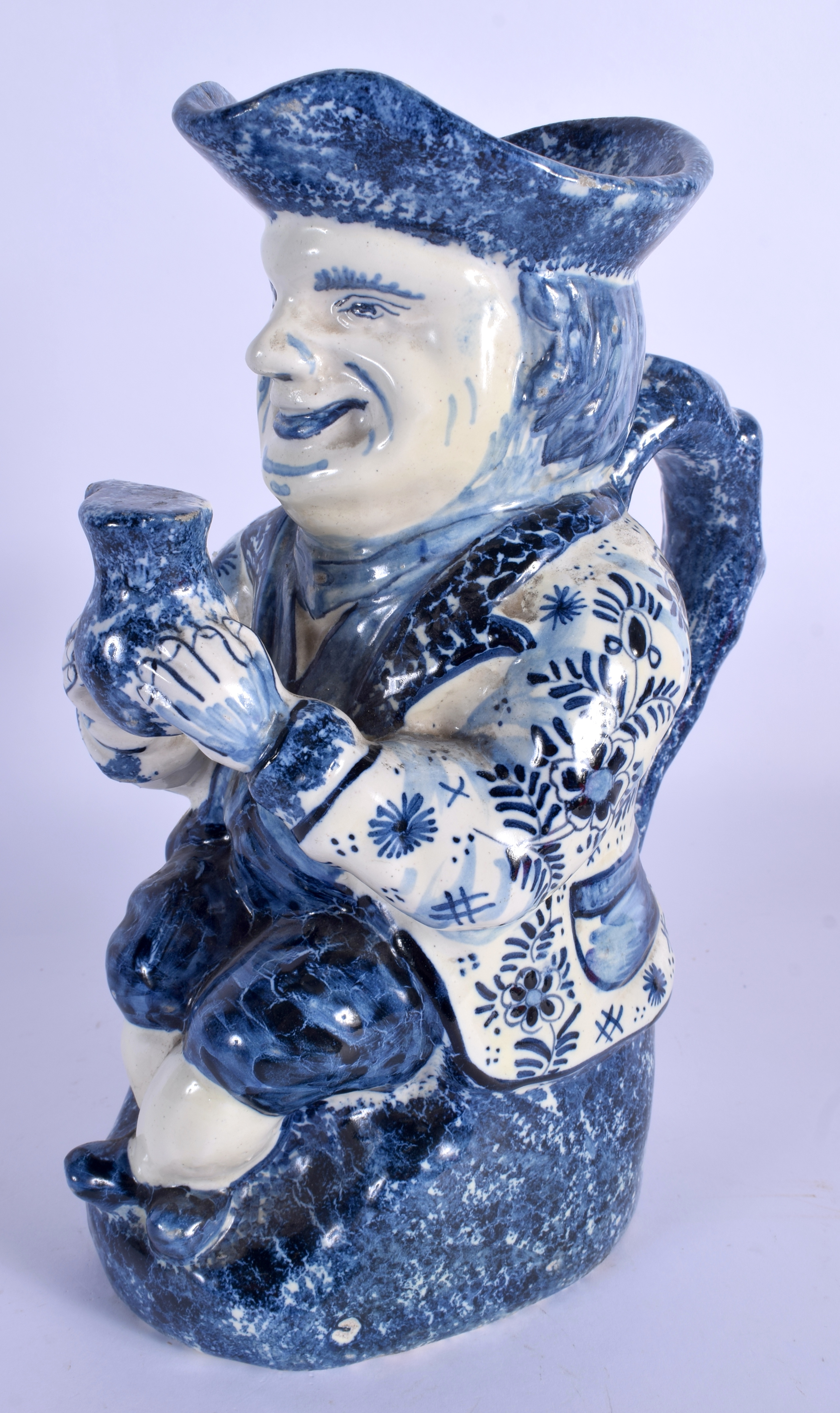 AN ANTIQUE DUTCH BLUE AND WHITE DELFT POTTERY TOBY JUG modelled as a male holding an ale jug. 27 cm