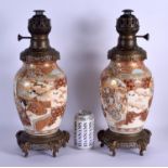 A LARGE PAIR OF 19TH CENTURY JAPANESE MEIJI PERIOD SATSUMA VASES converted to oil lamps. 43 cm overa