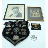 A collection of military badges and photographs .Qty.