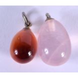 TWO VINTAGE HARDSTONE EASTER EGG PENDANTS. 1.25 cm x 1 cm. (2)