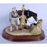 A BORDER FINE ARTS FIGURE OF TWO HORSES modelled with two attendants beside a well. 25 cm x 17 cm.