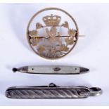 AN 1874 ENGLISH SILVER BROOCH and two knives. (3)