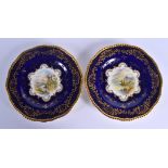 Late 19th/Early 20th c. Coalport pair of plates painted by Percy Simpson, signed, with landscapes ti