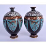 A PAIR OF EARLY 20TH JAPANESE MEIJI PERIOD CLOISONNE ENAMEL VASES decorated with foliage. 15.5 cm hi