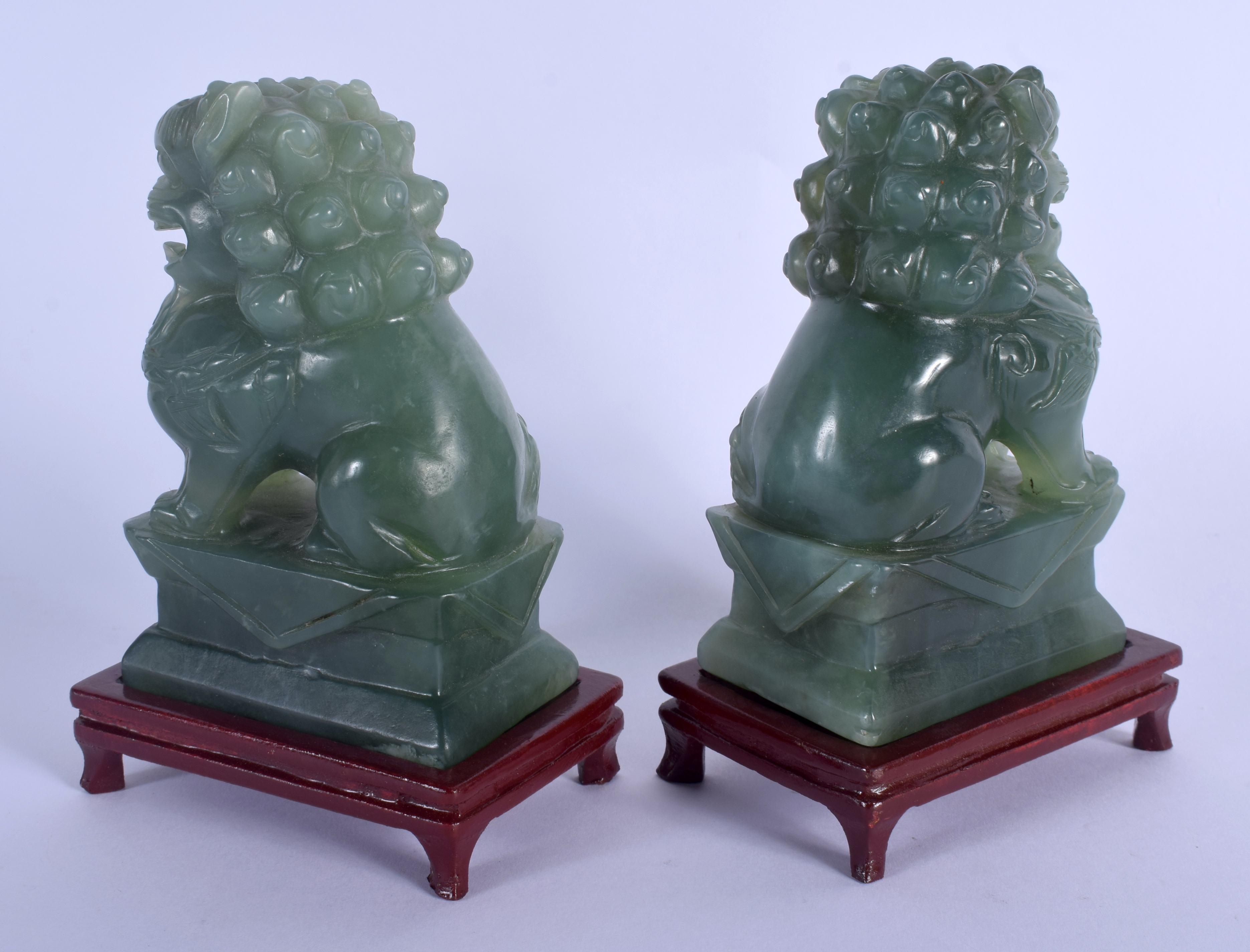 A PAIR OF EARLY 20TH CENTURY CHINESE CARVED JADE FIGURES OF LIONS Late Qing/Republic. Jade 12 cm x 6 - Image 2 of 3