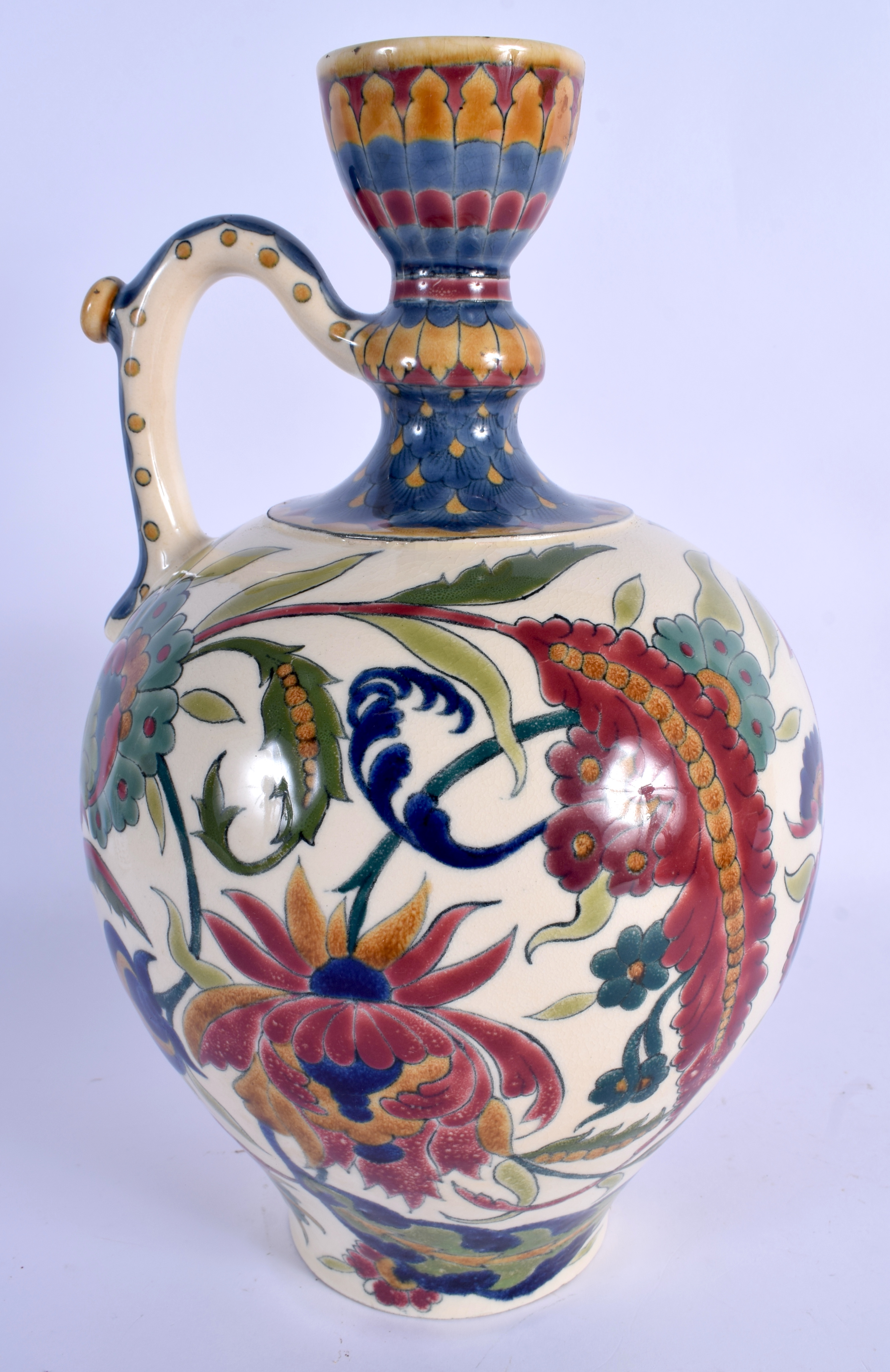 AN ANTIQUE HUNGARIAN ZSOLNAY PECS POTTERY EWER painted with stylised flowers and vines. 32 cm high. - Image 2 of 3