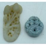 A carved jade pendant in the shape of a flower and lion pendant 7.5 cm.