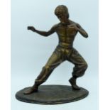 A bronze statue of Bruce Lee 35cm.