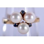 A 9CT GOLD PEARL AND SAPPHIRE RING. 4 grams. M/N.